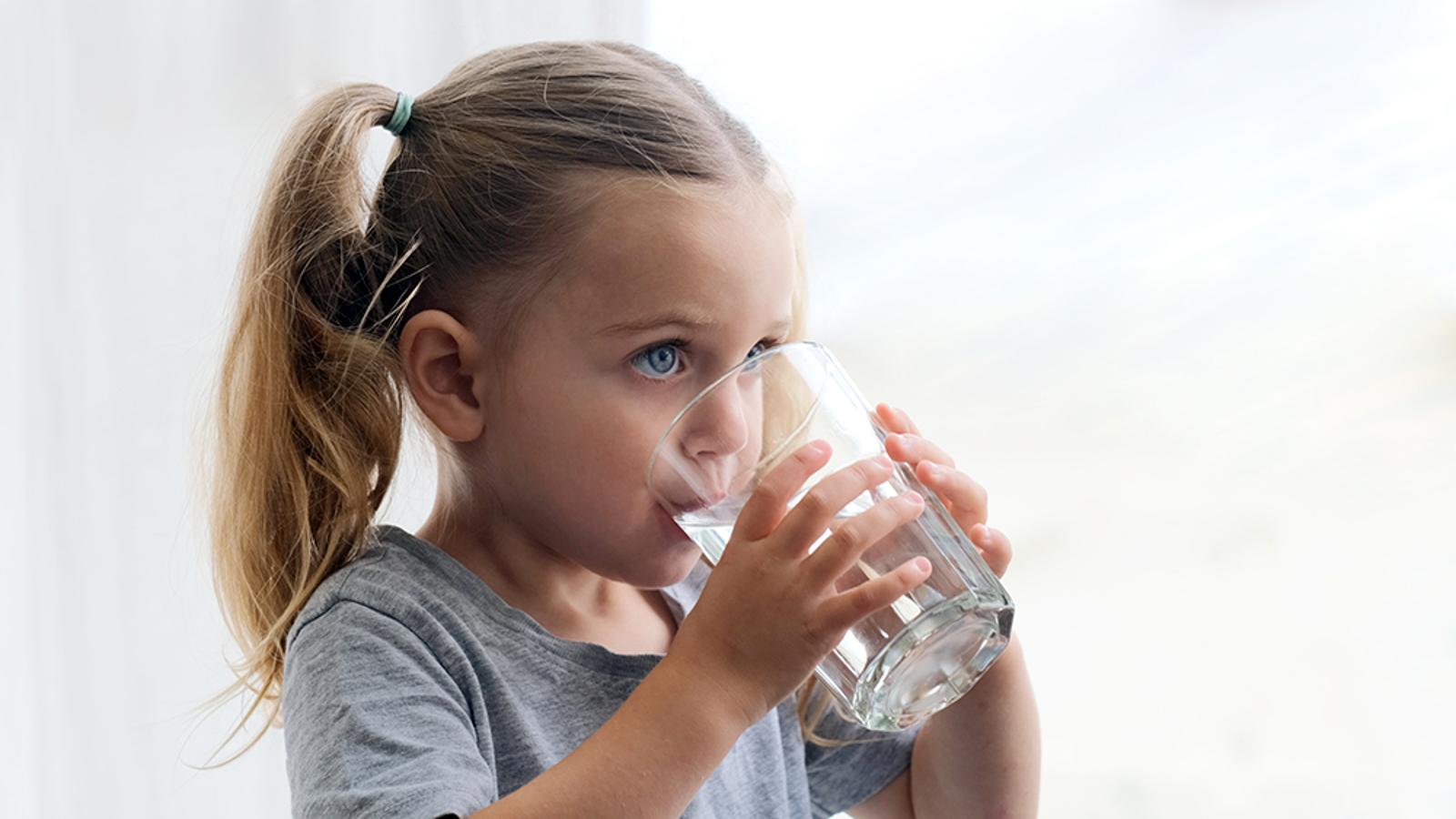 Little girl drinking water