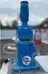 Muller Weingarten industrial machine with vertical motor and cylindrical base on metal platform