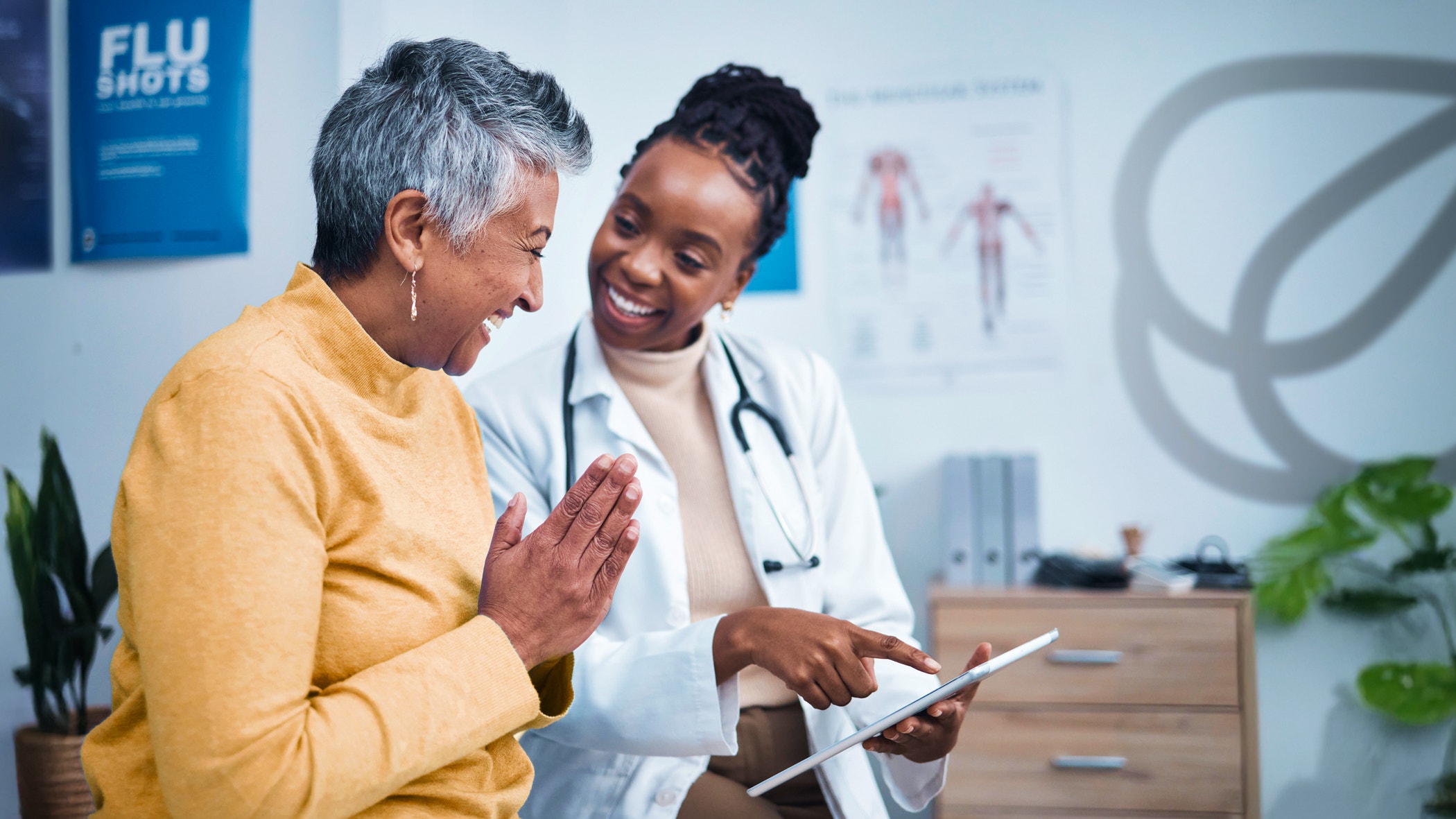 Black woman, doctor and elderly patient with good news, tablet and results for health, advice and report.