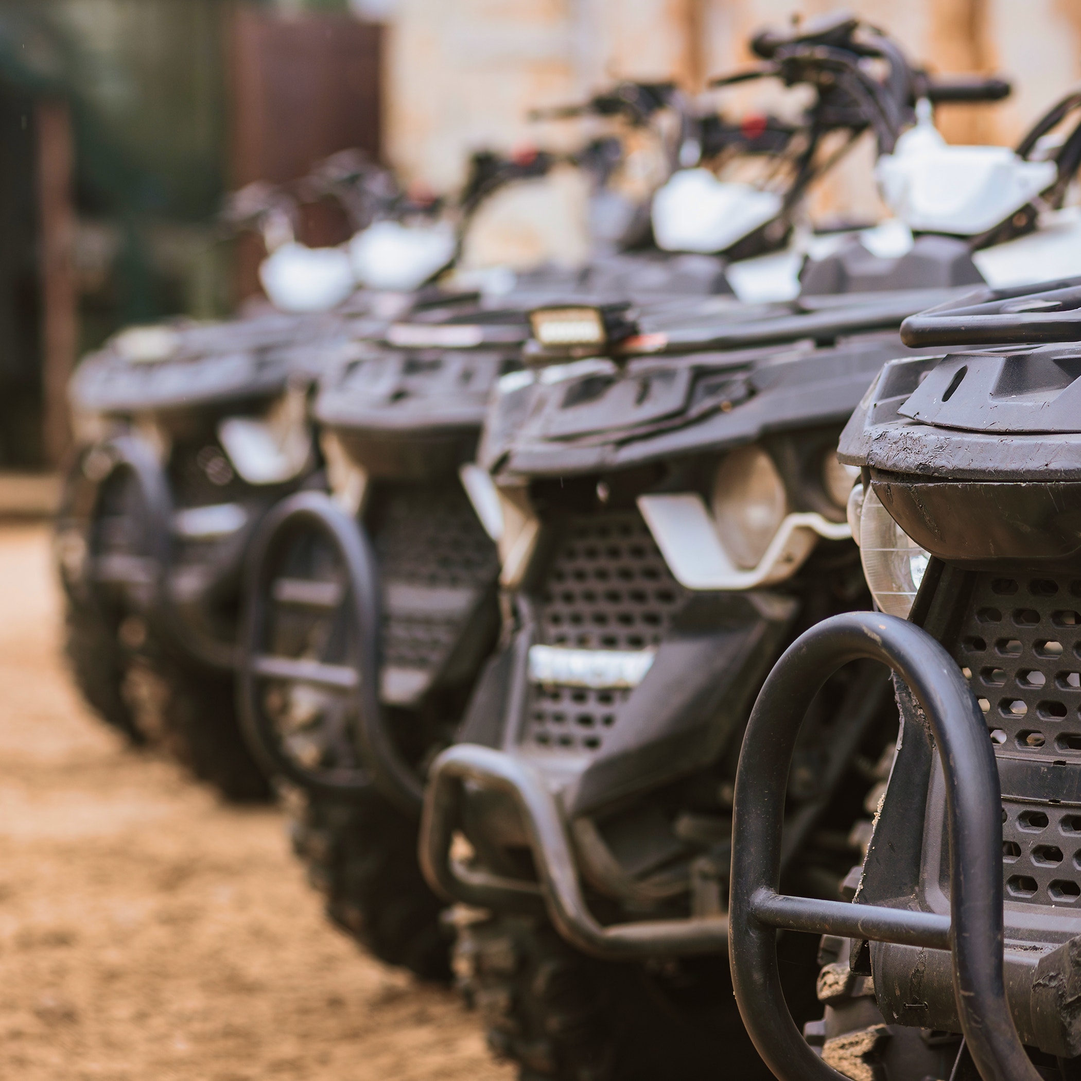 Closeup of modern ATV quad bikes prepared for tourist drives.