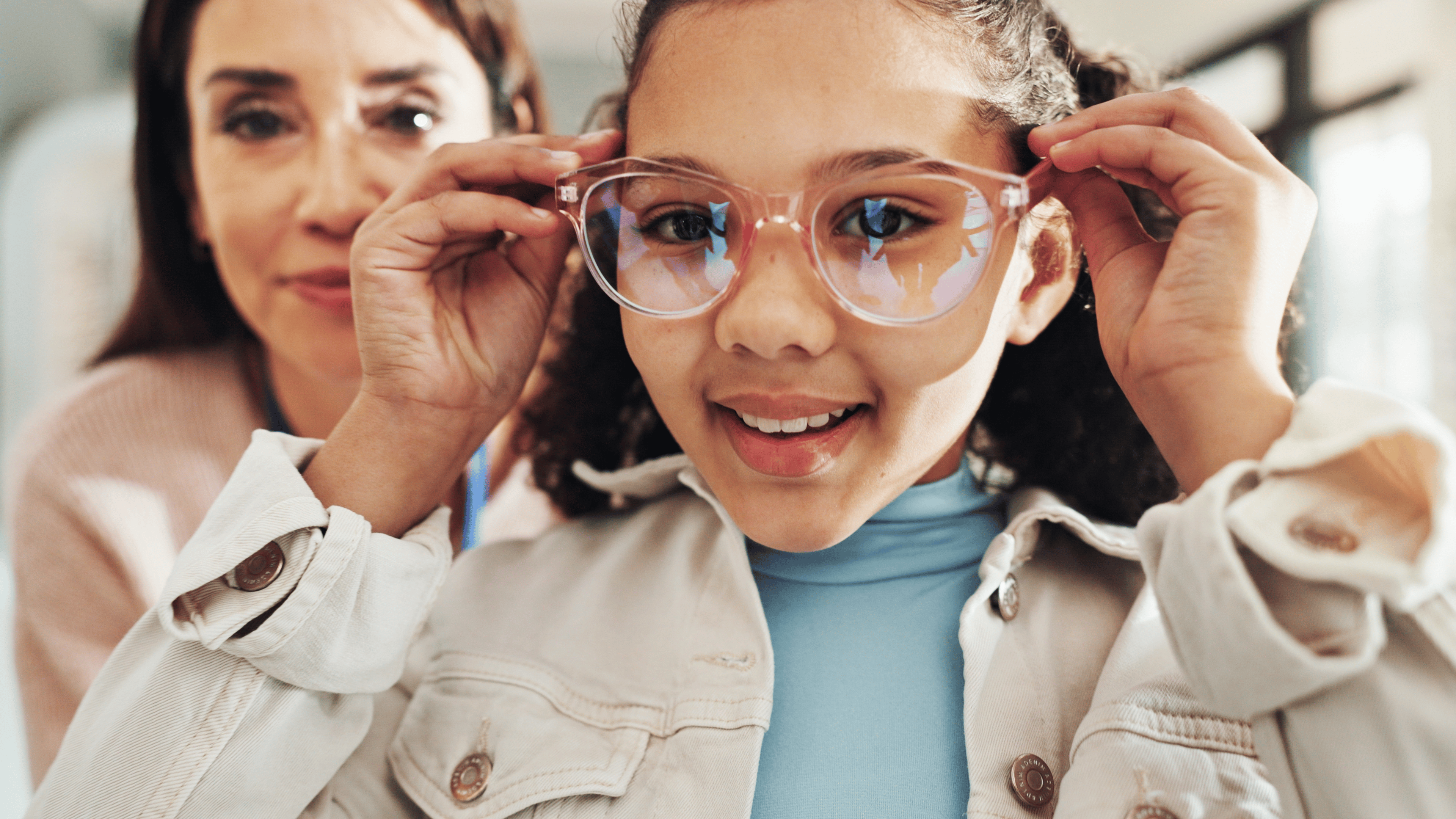 Eyewear, optometry and portrait of girl with woman in hospital for appointment, checkup and eye care.