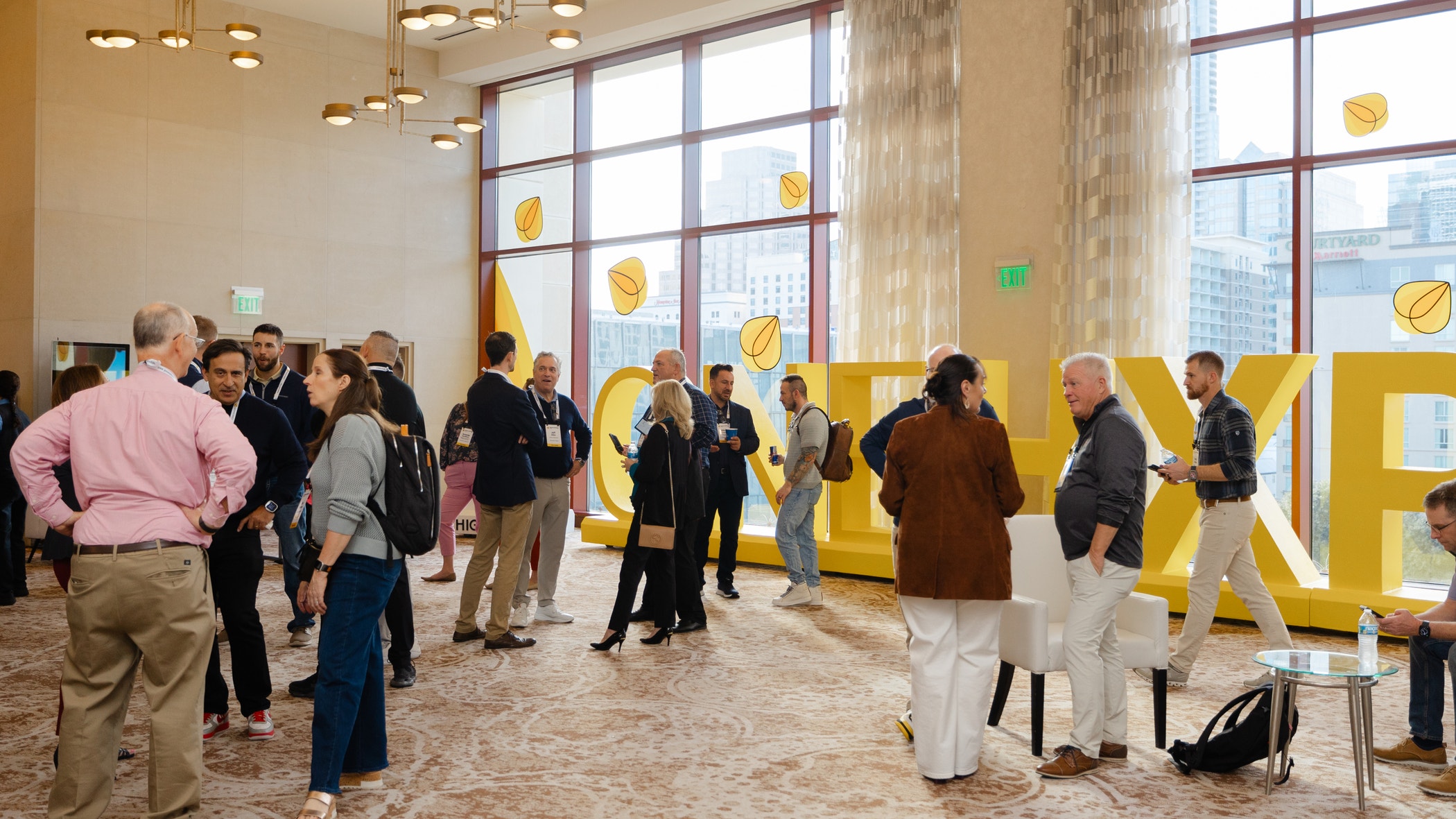 Corporate crowd showcasing teamwork and networking during a business event in a contemporary office setting. Professional and collaborative atmosphere.