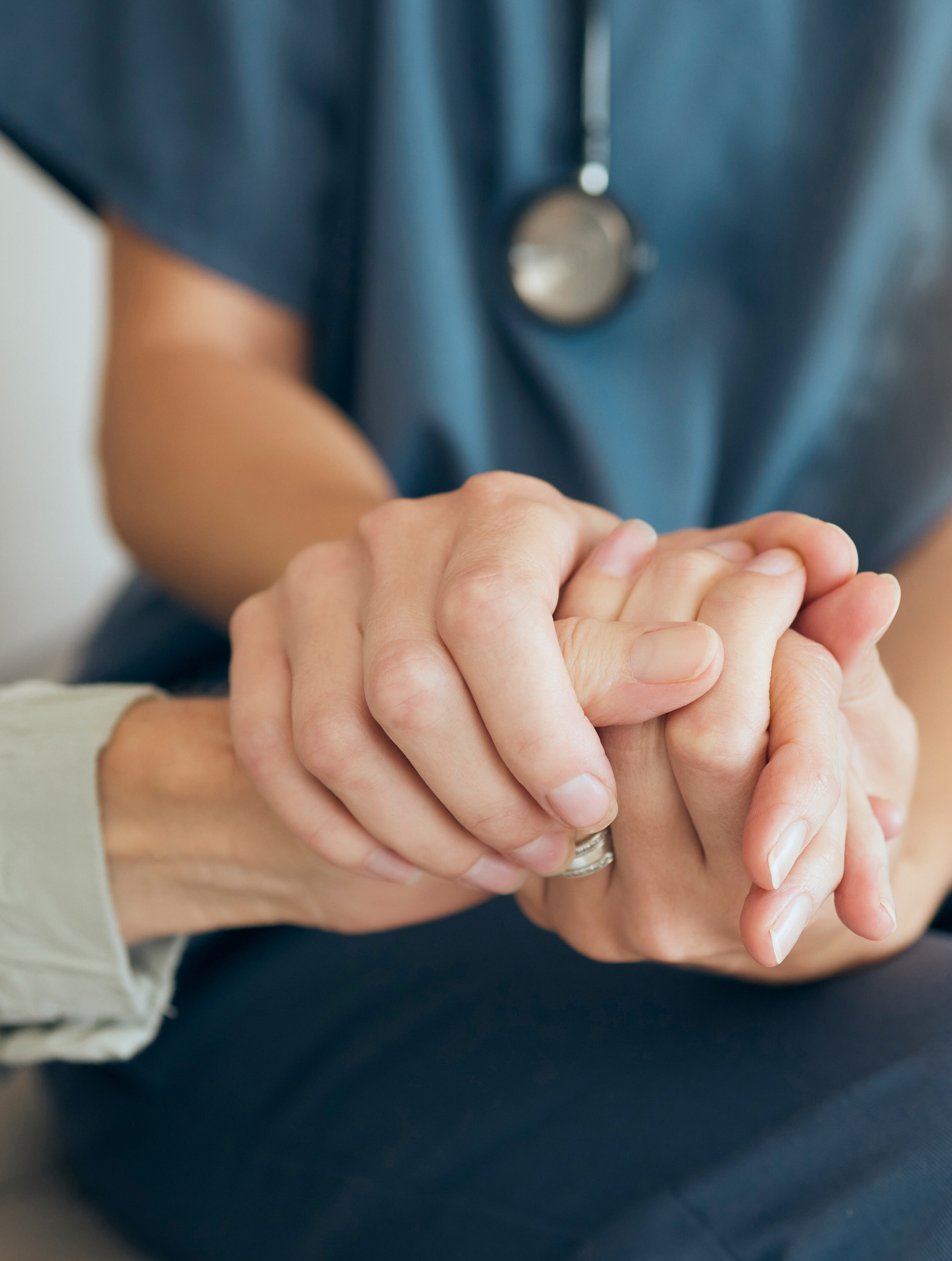 Senior care, woman and nurse or hand holding for comfort, assisted living and nursing home or retirement support.