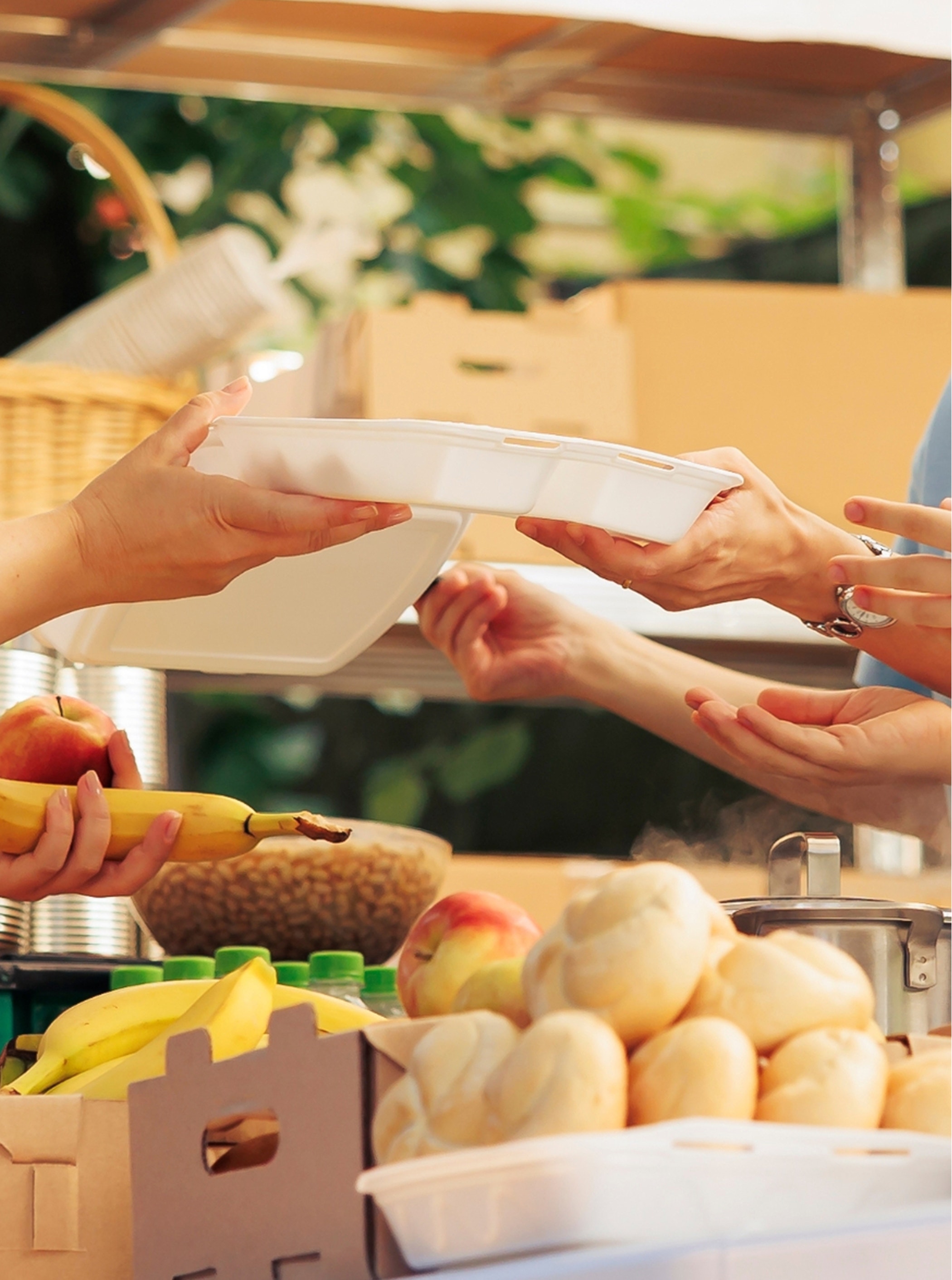 Homeless, refugees, and the hungry receive meals and donations from generous volunteers.