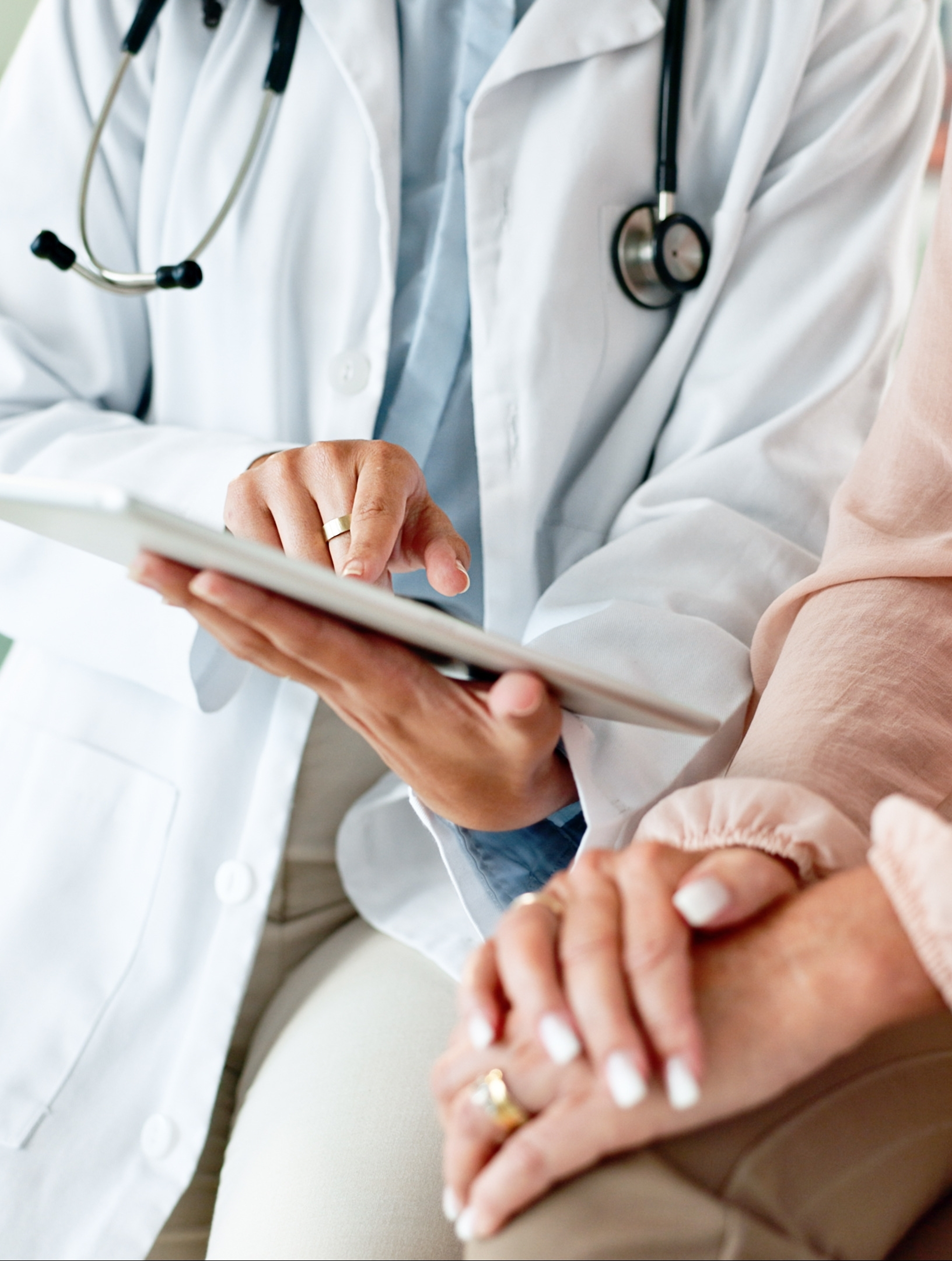 Clinic, tablet and hands of doctor with patient for consulting, medical service and help in hospital.
