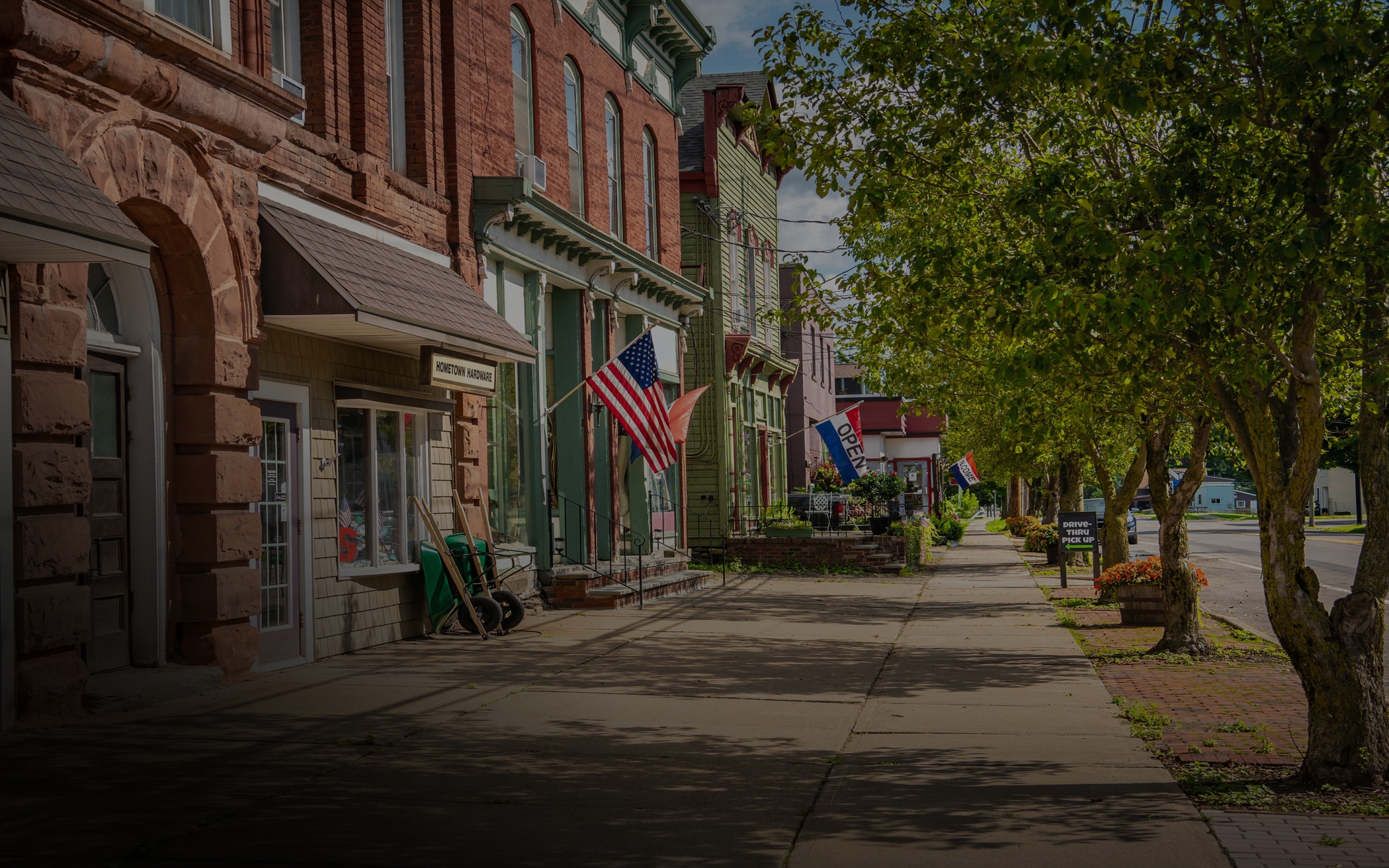 Main street U.S.A. store fronts on a summer day in a small town.