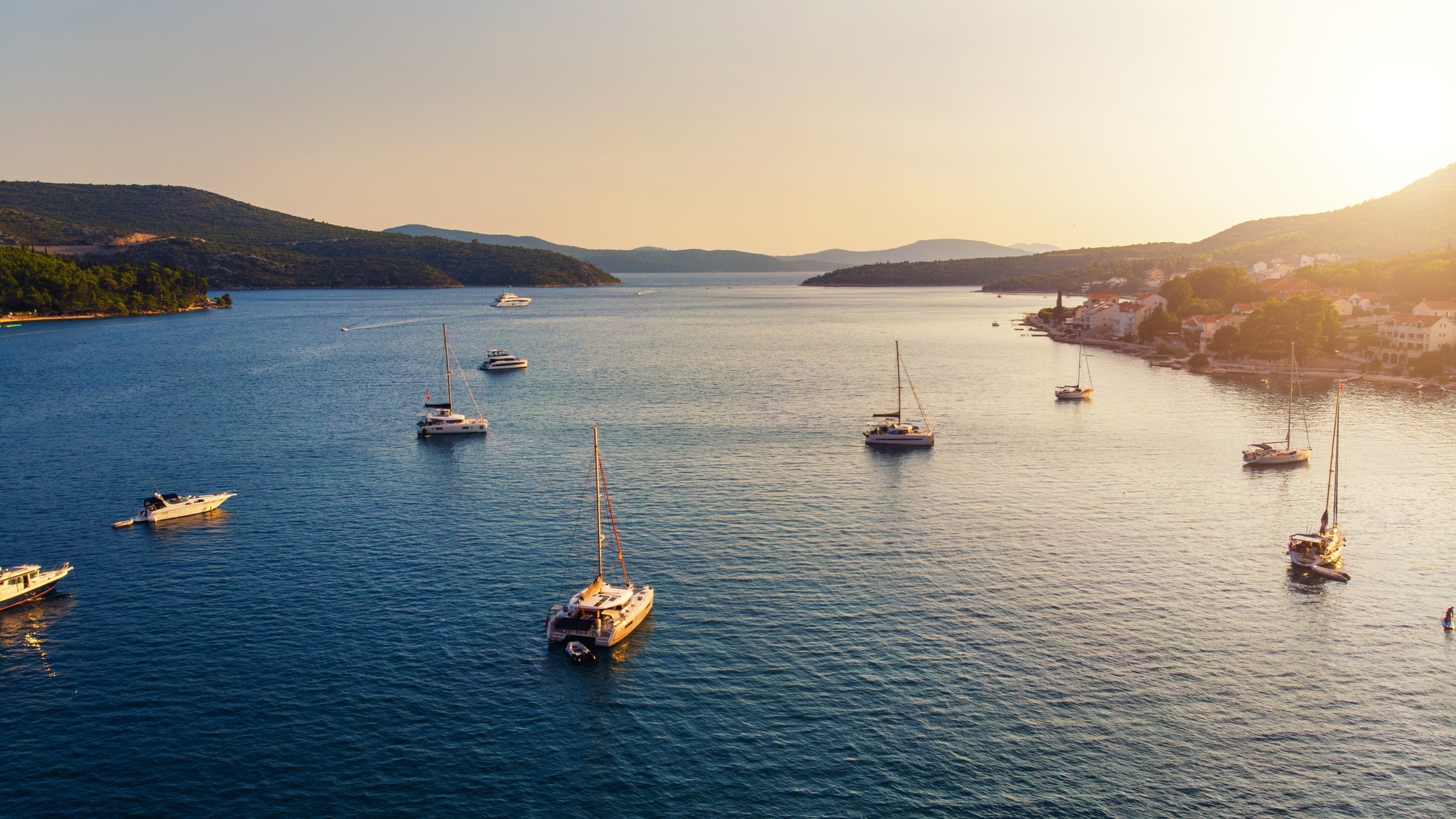 Marina harbor sailboats warm sunlight seascape landscape.
