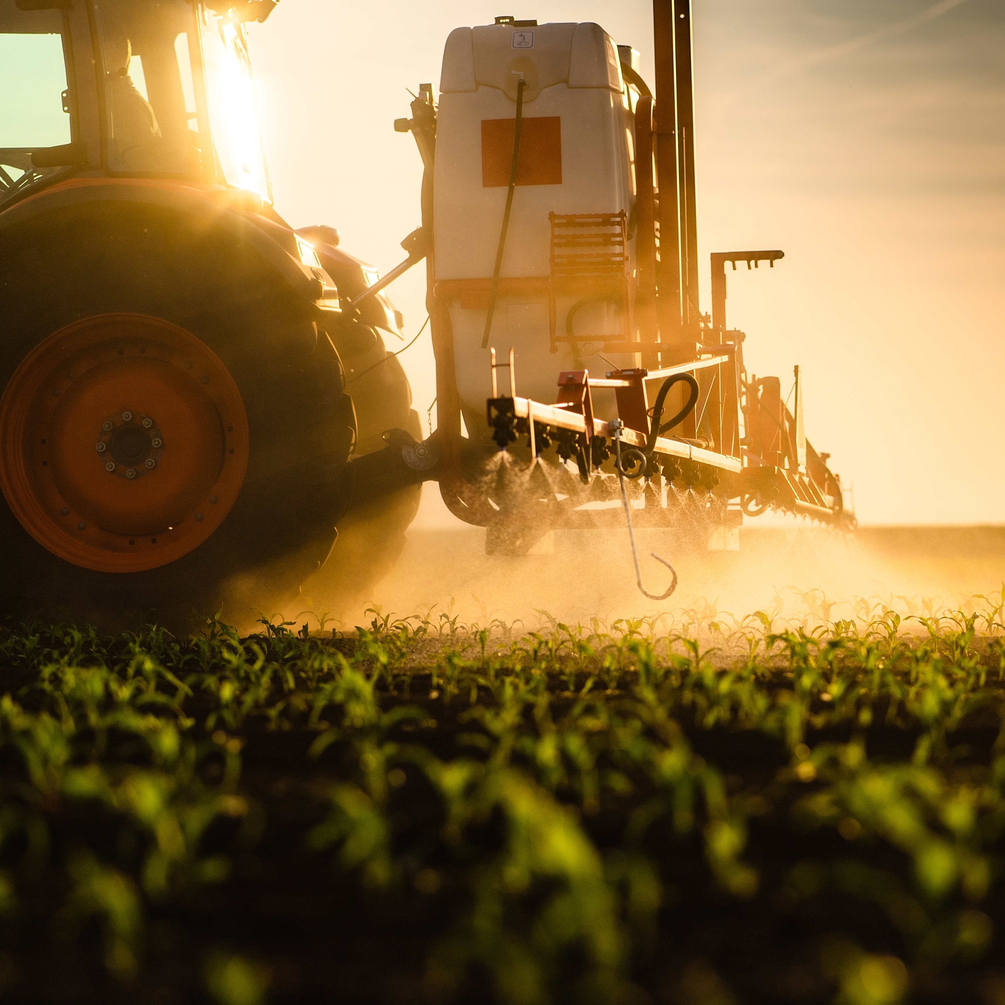 Farm equiptment spraying field.