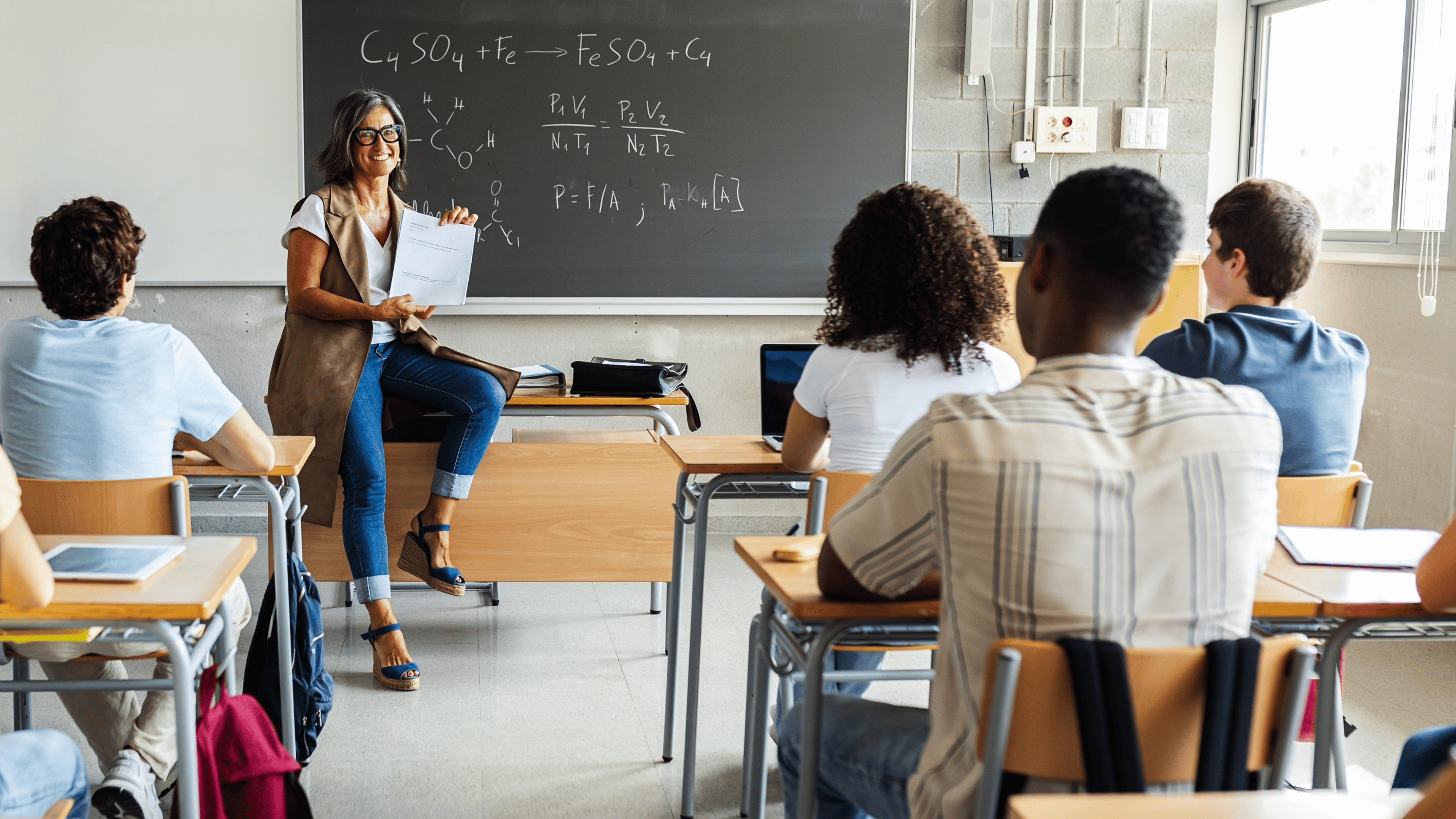 Young group of gen z students attending class at high school.