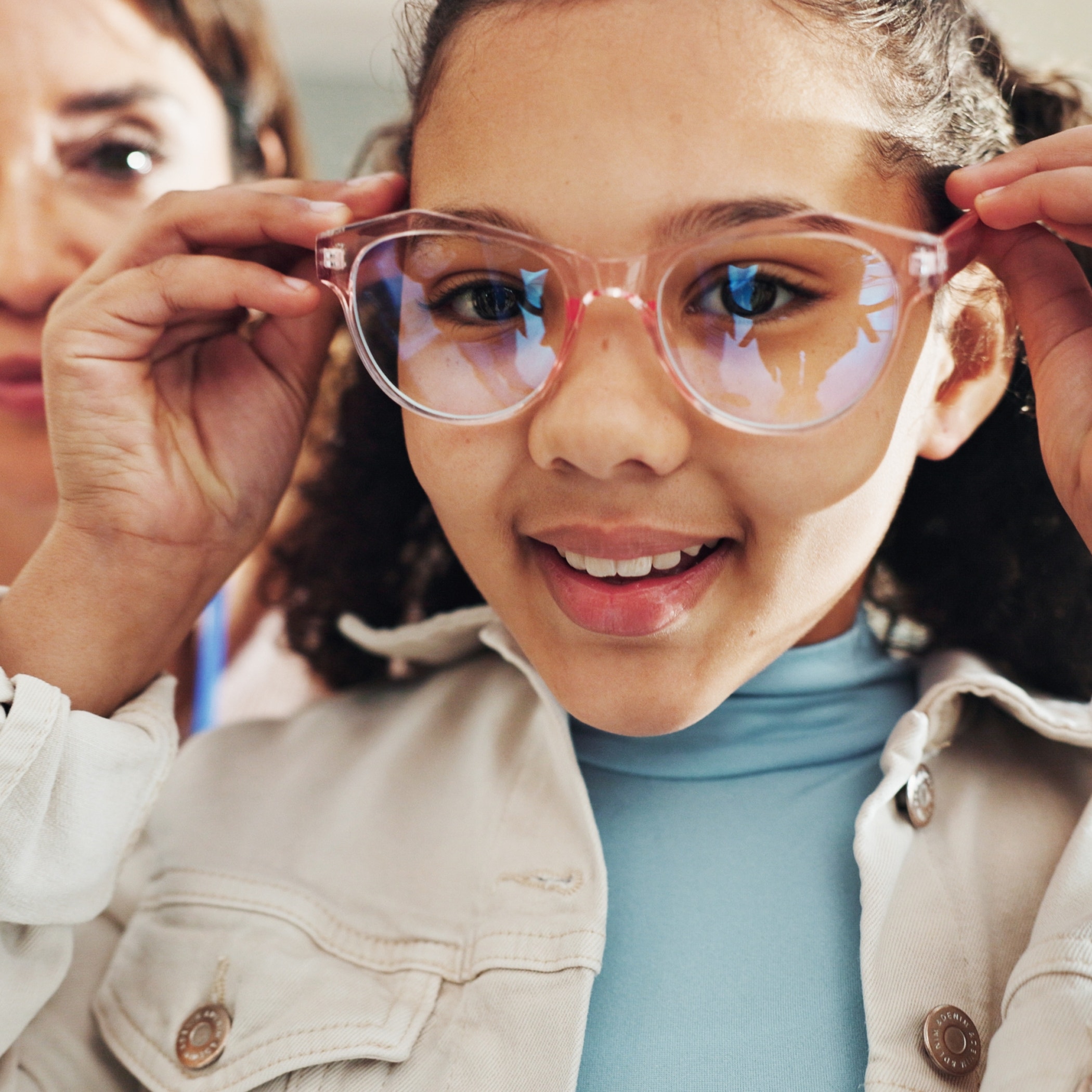 Eyewear, optometry and portrait of girl with woman in hospital for appointment, checkup and eye care.