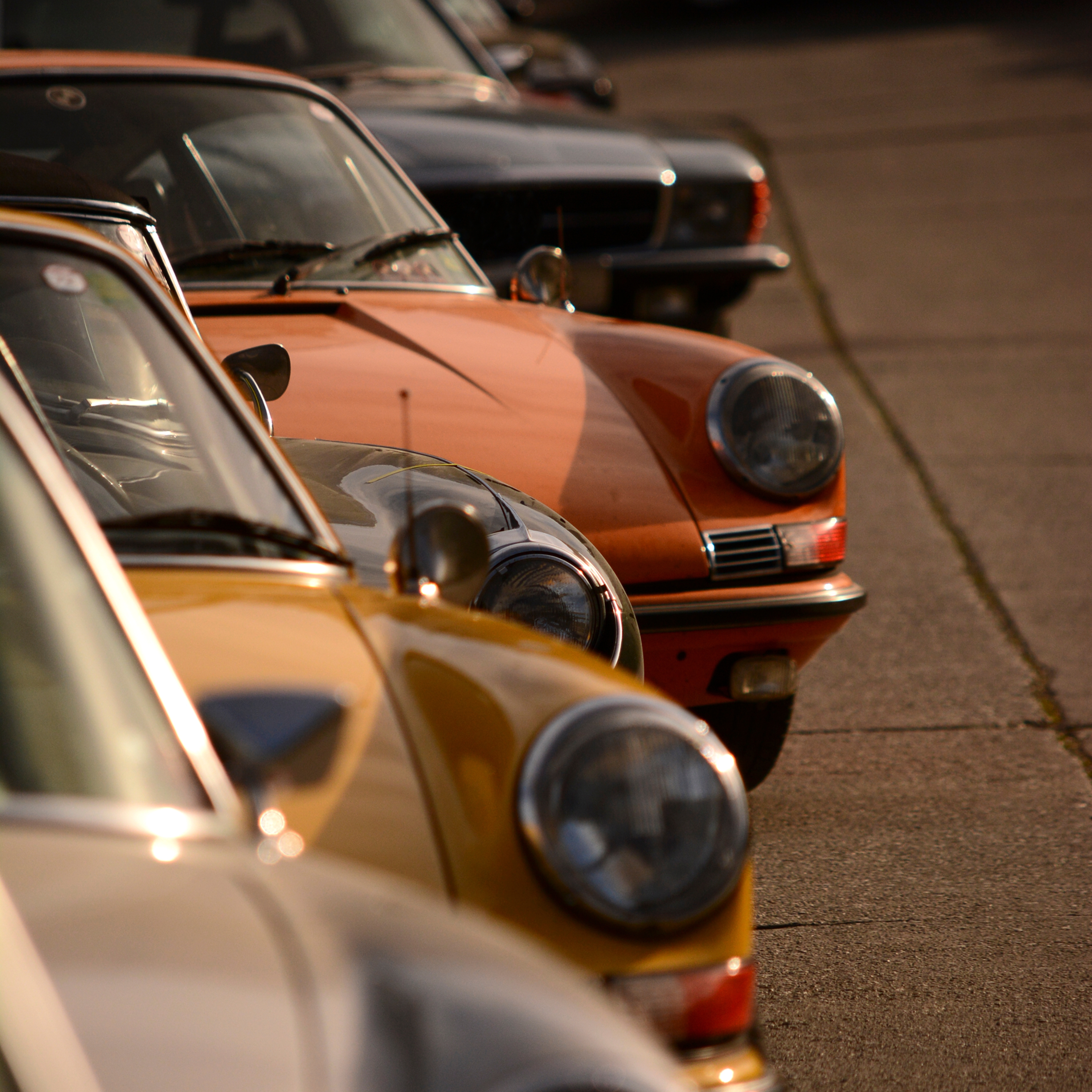 Sports collection cars parked with selective focus, vintage cars in different colors.