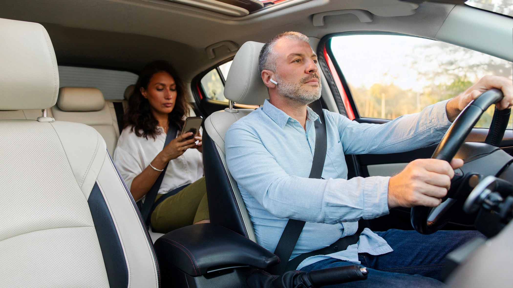 Rideshare insurance hero wide driver passenger