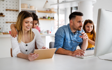 A family looking at a computer