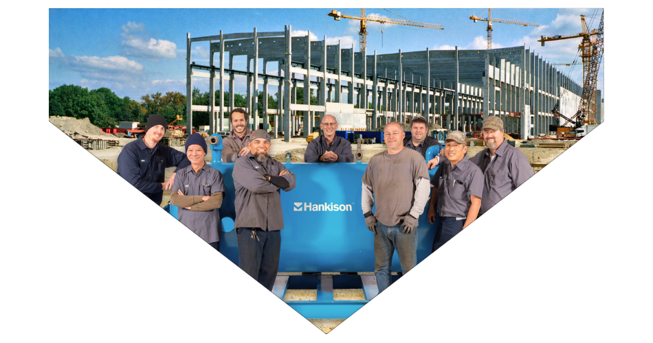 Hakison Rental team in front of a compressed air dryer on a construction site - banner