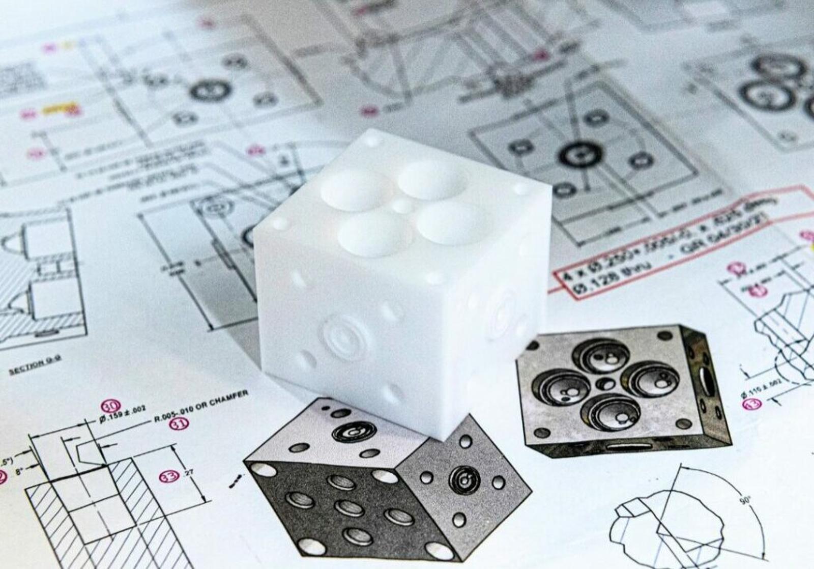 plastic-part-on-top-of-plans.jpg