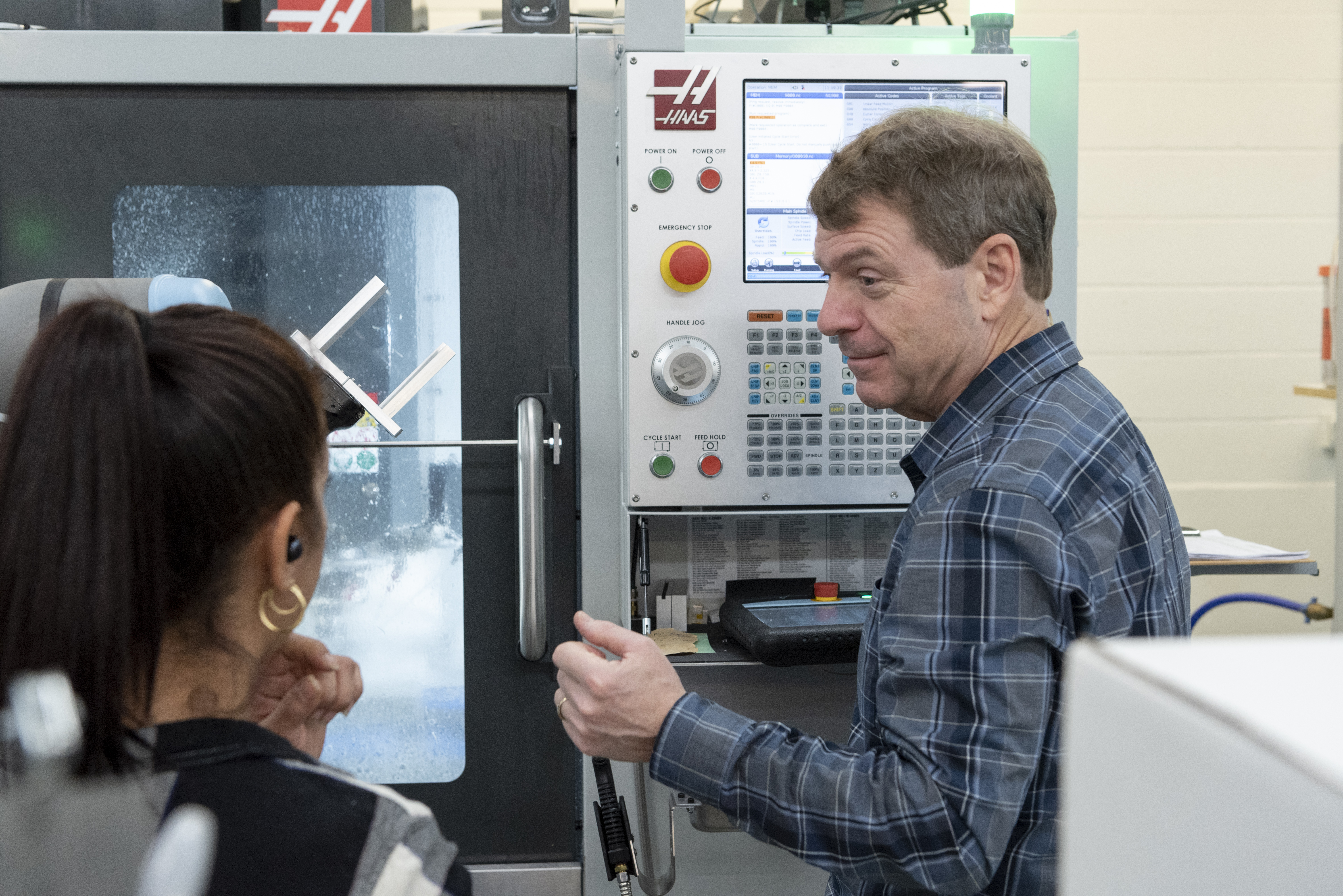 man-with-plastic-cnc-machine.jpg