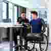 man-helping-man-in-wheelchair-683x1024-square.jpg