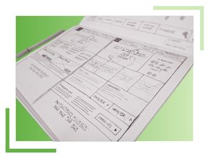 A notebook with a pen resting on top of a sheet of paper, arranged neatly for writing or note-taking.
