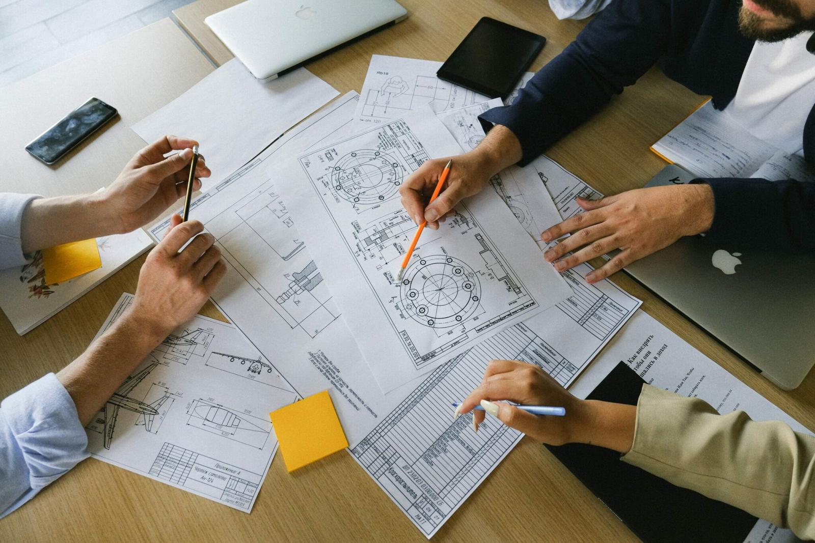 hands-on-white-engineeringplans-scaled.jpg