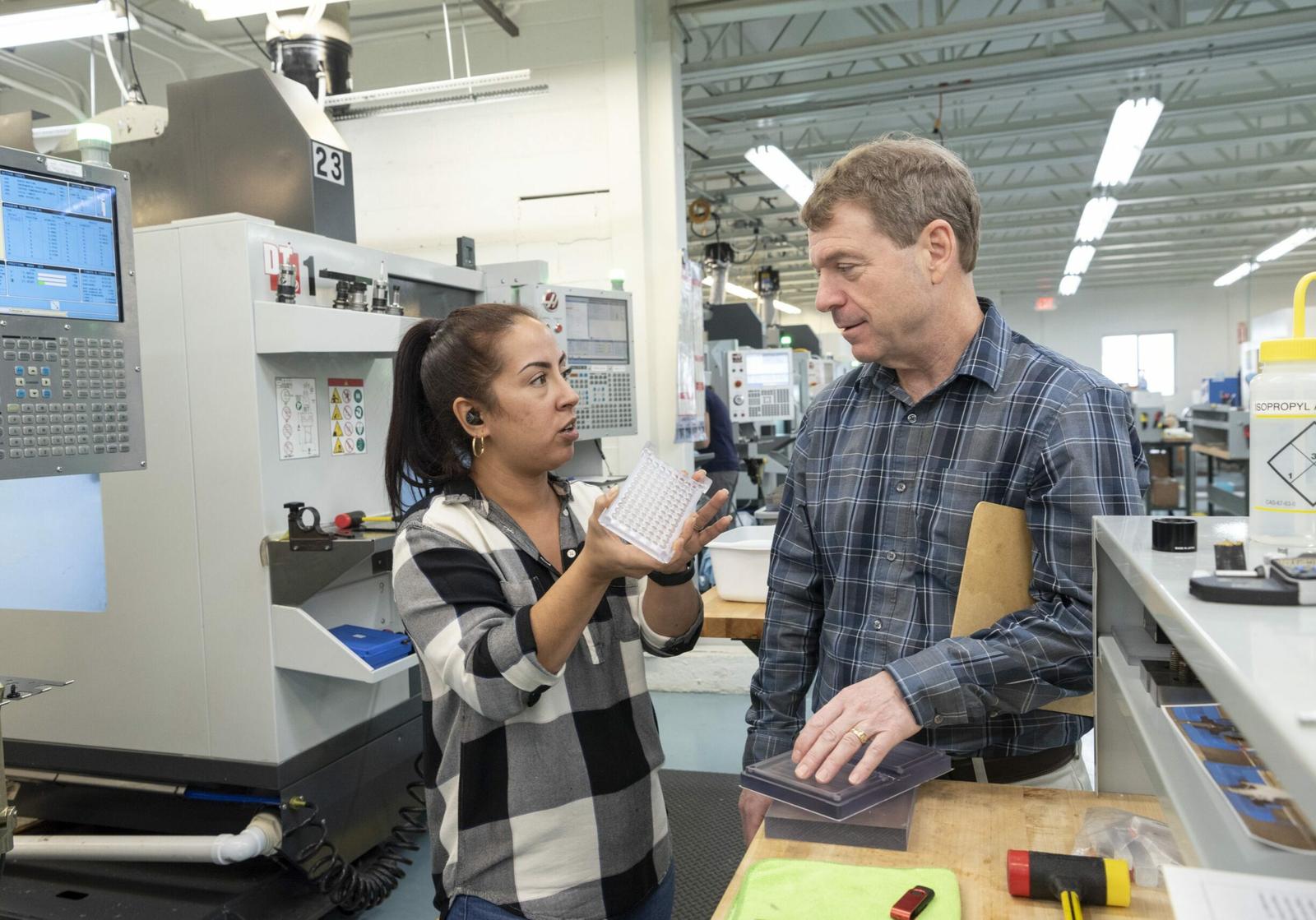 two-people-in-factory-talking-scaled-landscape.jpg