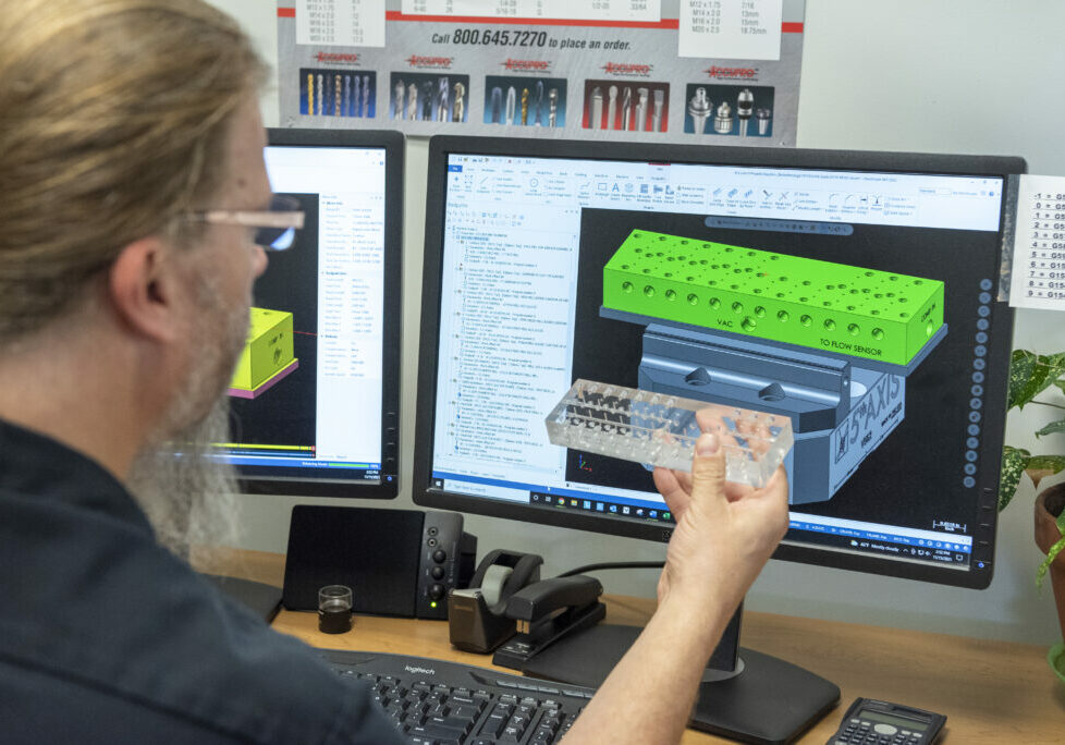 man-at-computer-analyzing-plastic-part-1024x684-.jpg