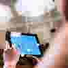 banner-woman-with-ipad-in-theatre.png