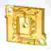 Transparent amber-colored rectangular ULTEM plastic component with internal channels and holes featuring two large corner holes and intricate internal pathways as a custom microfluidic component