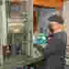man-working-cnc-machine-1024x1024-square.jpg