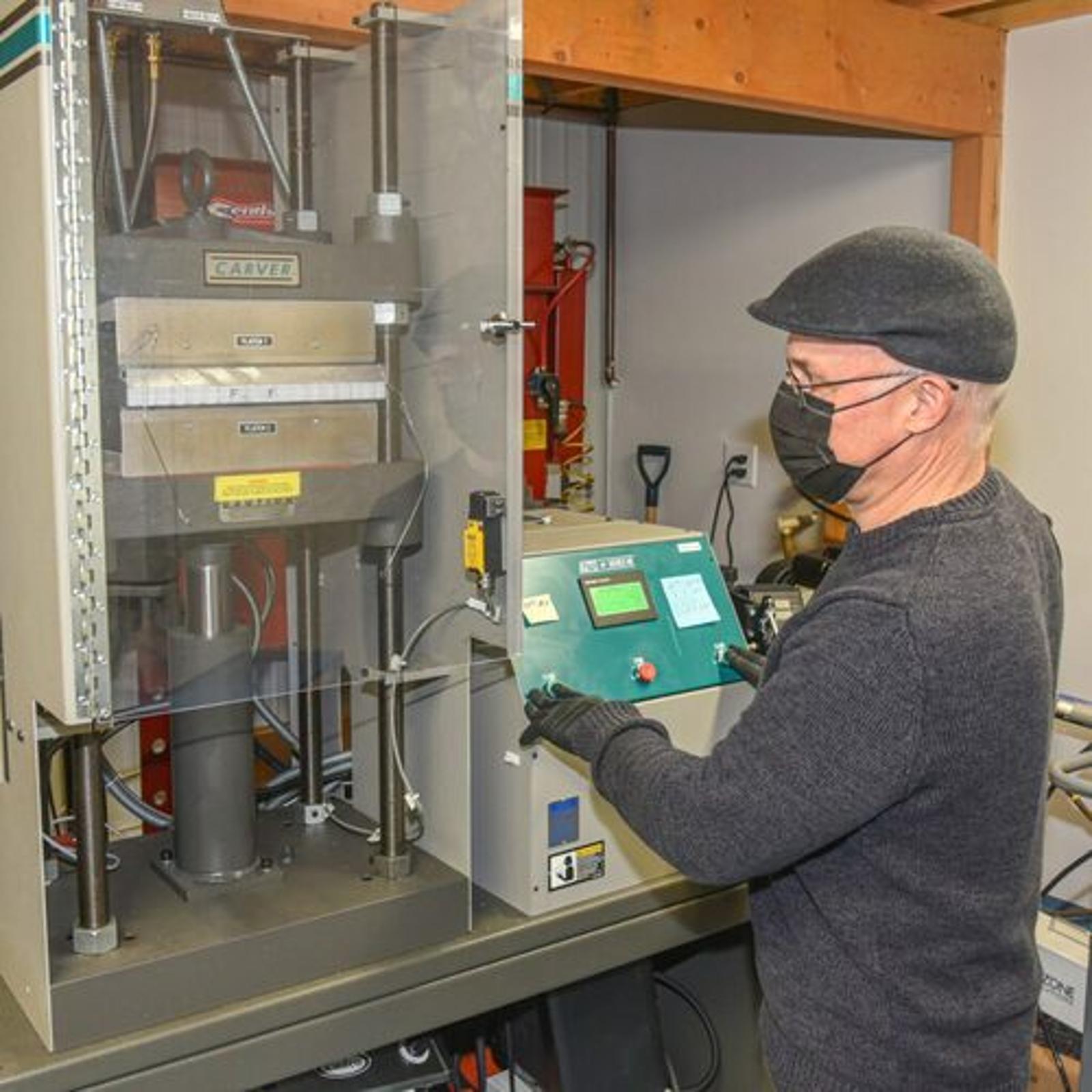 man-working-cnc-machine-1024x1024-square.jpg