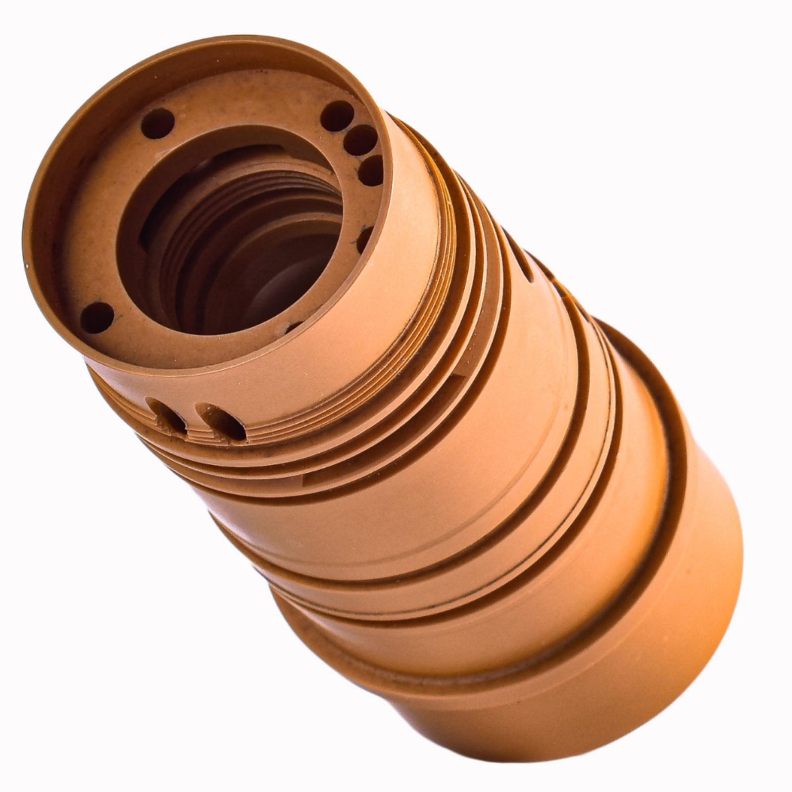 A cylindrical, copper-brown PPS plastic insulator component with several grooves, holes, and ridges, photographed on a white background.