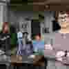 person-looking-into-camera-coworkers-behind-them-1024x683-square.jpg