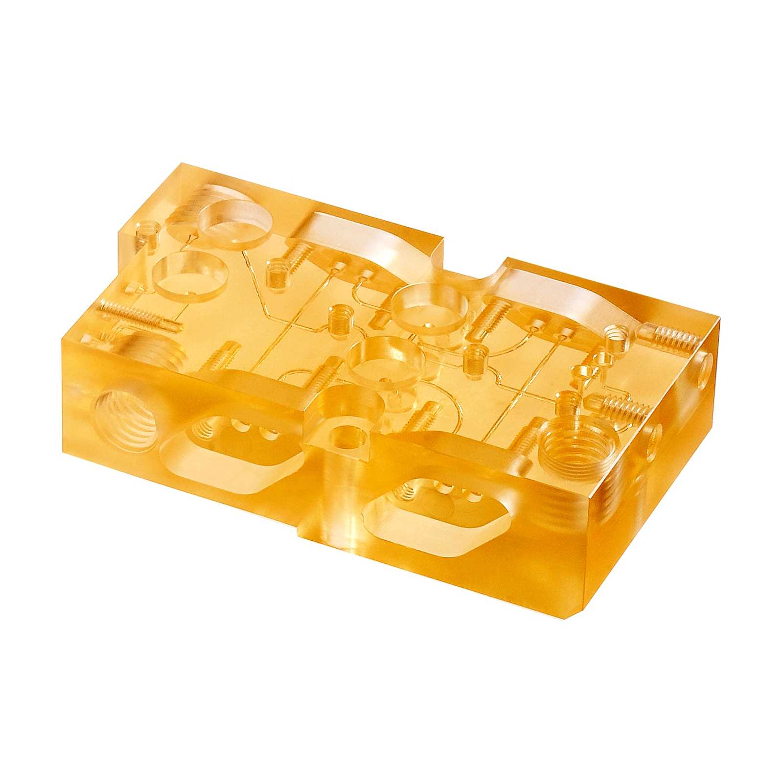 Transparent amber-colored diffusion bonded polysulfone plastic microfluidic chip with multiple CNC machined channels, circular inlets, and ports on its surface, shown on a white background.