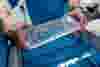 hands-holding-wet-acrylic-manifold.jpg