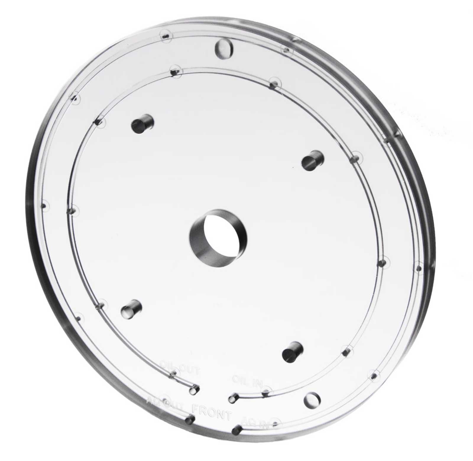 A clear polycarbonate plastic circular silver dispensing manifold with a smooth surface, featuring a central hole and multiple smaller holes around it, conveying precision engineering.