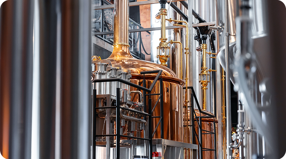 Brewery fermentation tanks requiring precise temperature control through glycol cooling systems.