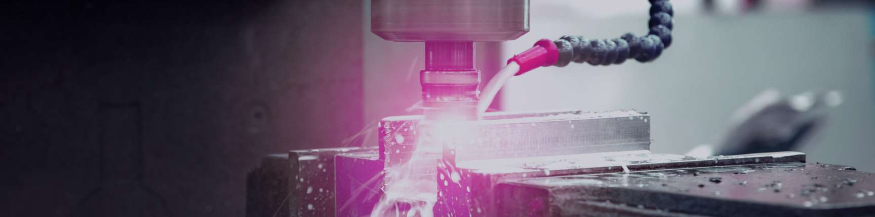 CNC machine tool on a production floor, representing laser & machine tool cooling applications.