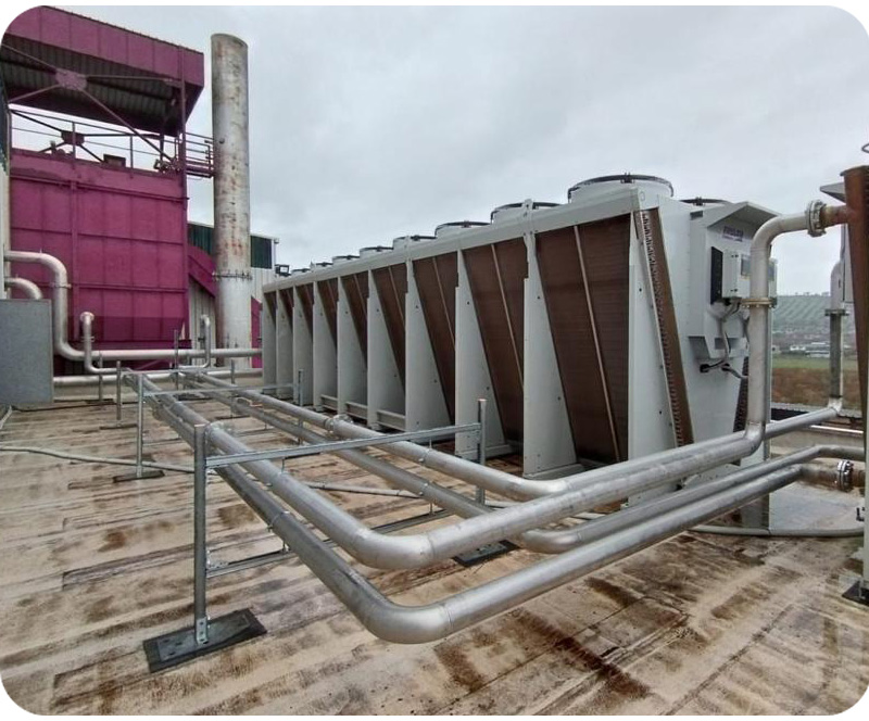 Centralized cooling system with industrial chillers serving energy and process industry facilities