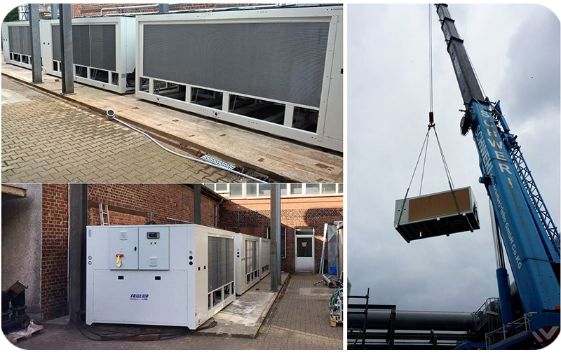 Industrial Friulair data center chiller being lifted by crane during professional installation.