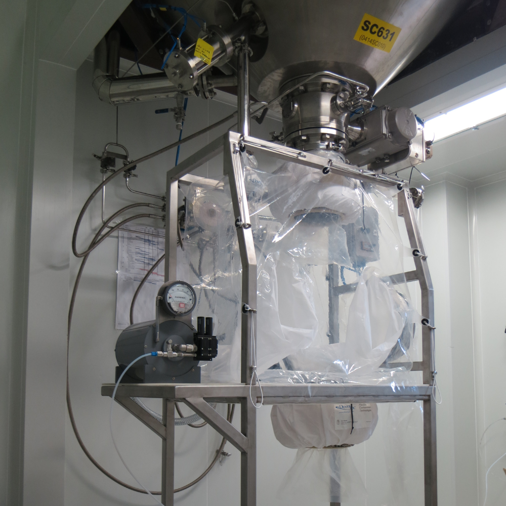 A metal rig with a sealed plastic container