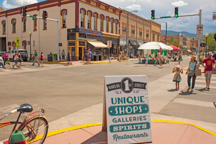 Locals stroll along 1st Street in Salida’s vibrant downtown on a sunny summer day.