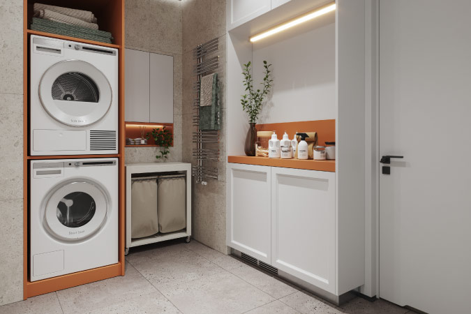 A modern laundry room utilizing organization hacks like stackable washer and dryer units, a divided laundry basket, and a wall-mounted drying rack.