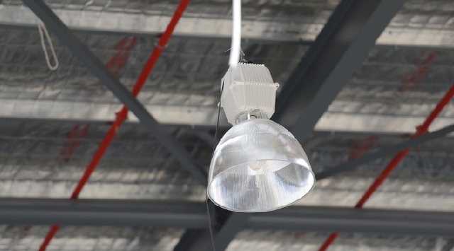 Industrial light fixture hanging from ceiling
