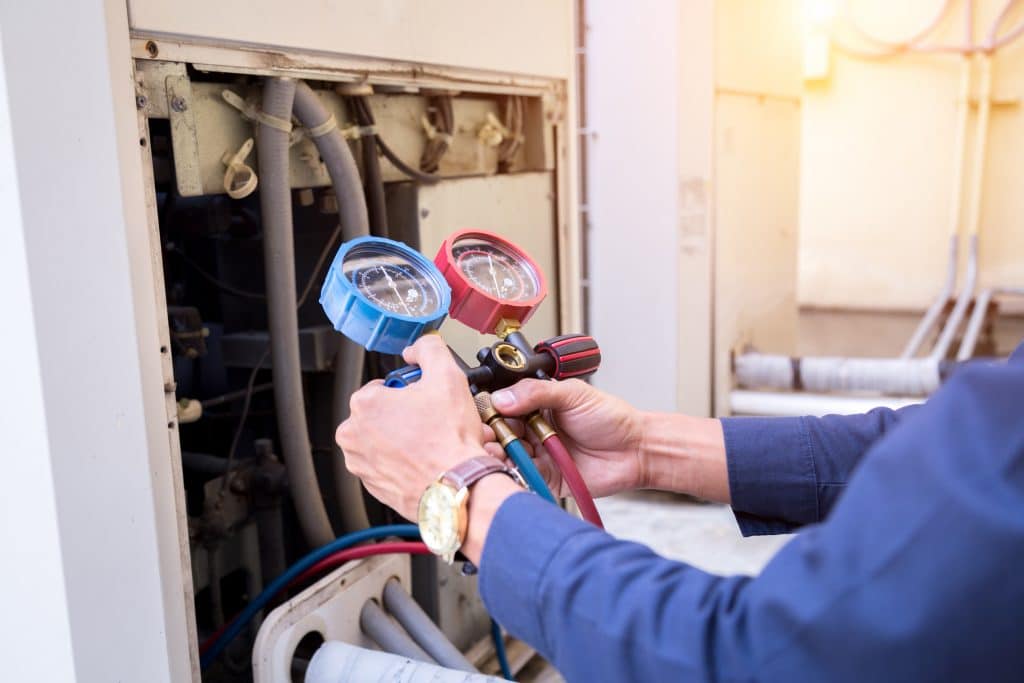 Commercial HVAC company technician using training tools