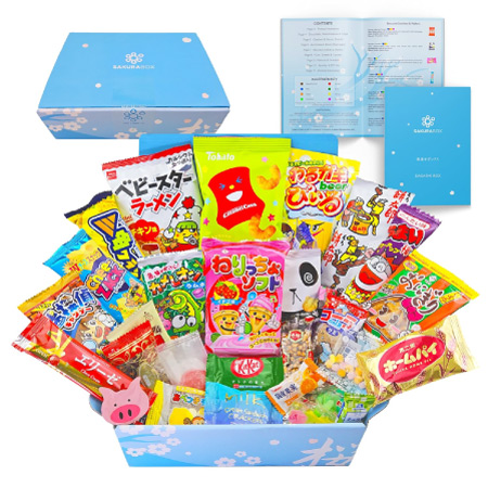A blue box filled with tons of international snacks in colorful packaging