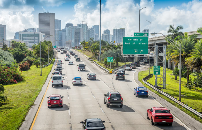 Rush hour traffic near Downtown Miami with the city’s skyscrapers visible in the distance.