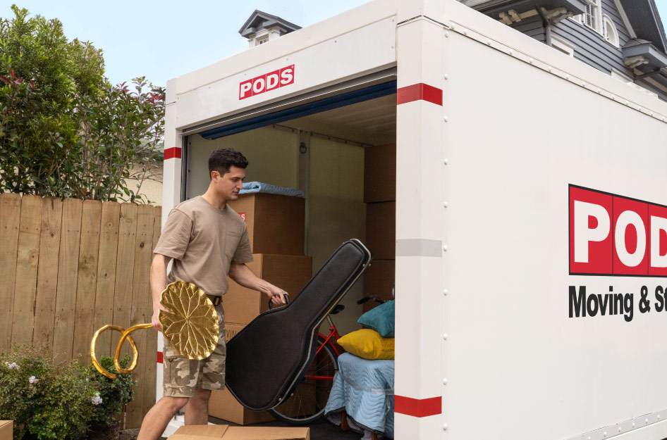 A soldier is loading a PODS portable moving container during his partial DITY move.