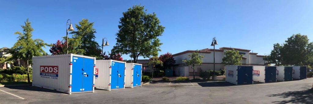 PODS containers in a parking lot during projects for school renovations