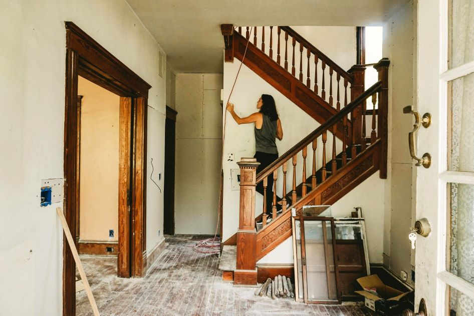 A young woman completes various home renovations before selling her home.