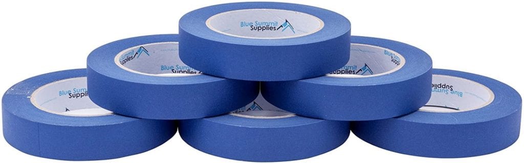 Six rolls of blue packing tape stacked in a triangle 