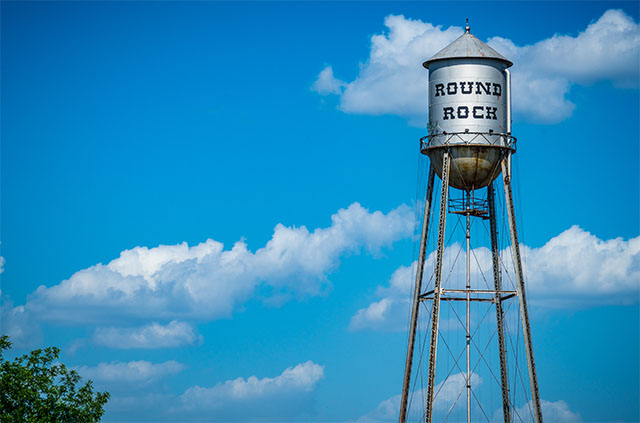 The Round Rock water tower on a bright, sunny day